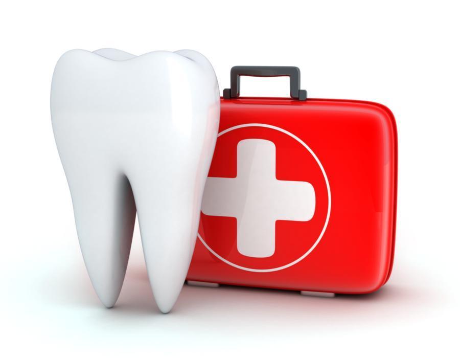An image of a tooth and a first aid kit | Concord NH root canals & extractions