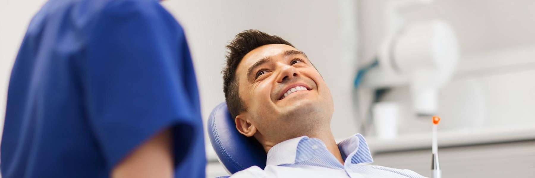 man sitting in a dental chair in concord nh